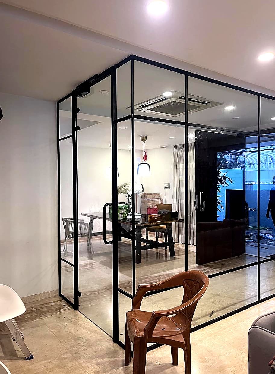 Fixed Glass Partition with Frameless Door. by Cube Partitions for premium glass partition projects